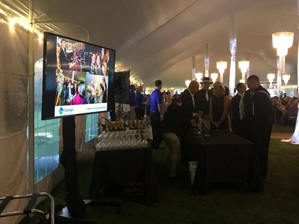 Cayuga Medical Center Gala - TV monitors on stands around venue