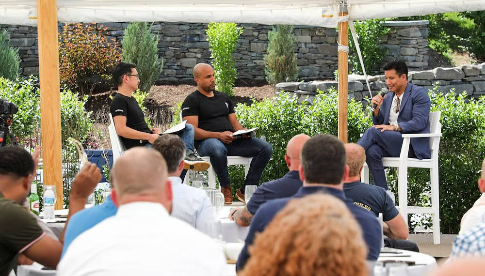 Outdoor retreat with presenters on a raised stage