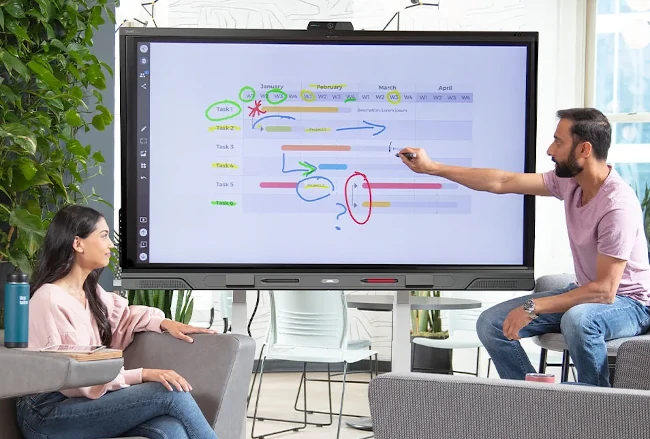 Person using a Smart Board or Collaboration Board in a meeting